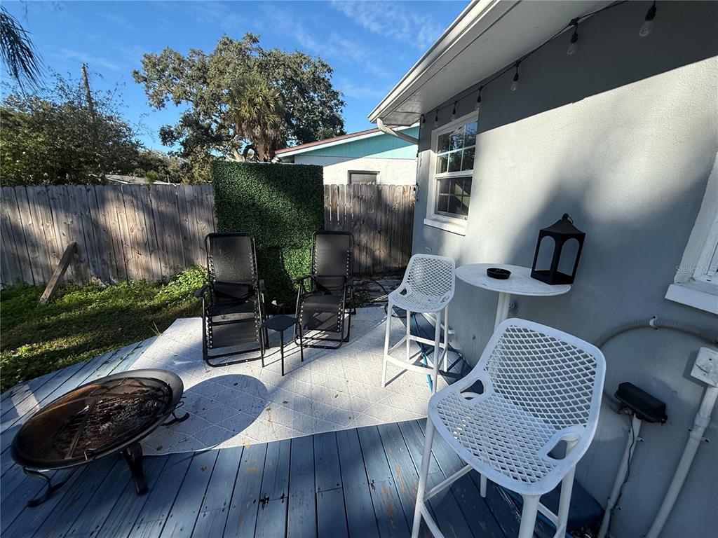 3066 19th Place Southwest Largo, FL 33774 - Photo 5 of 18 a view of a patio with couches chairs and a potted plant