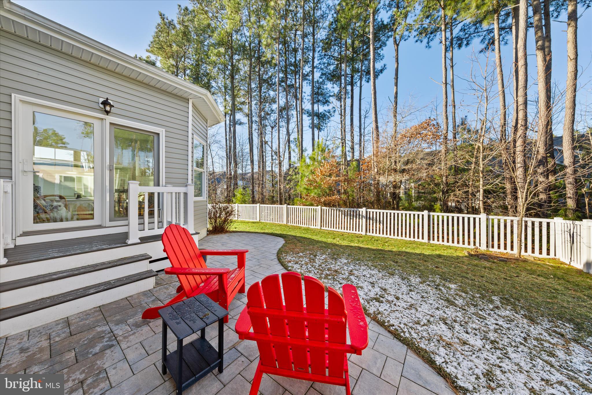 19181 Alcott Way Georgetown, DE 19947 - Photo 33 of 41 a view of a wooden chairs and bench in the backyard