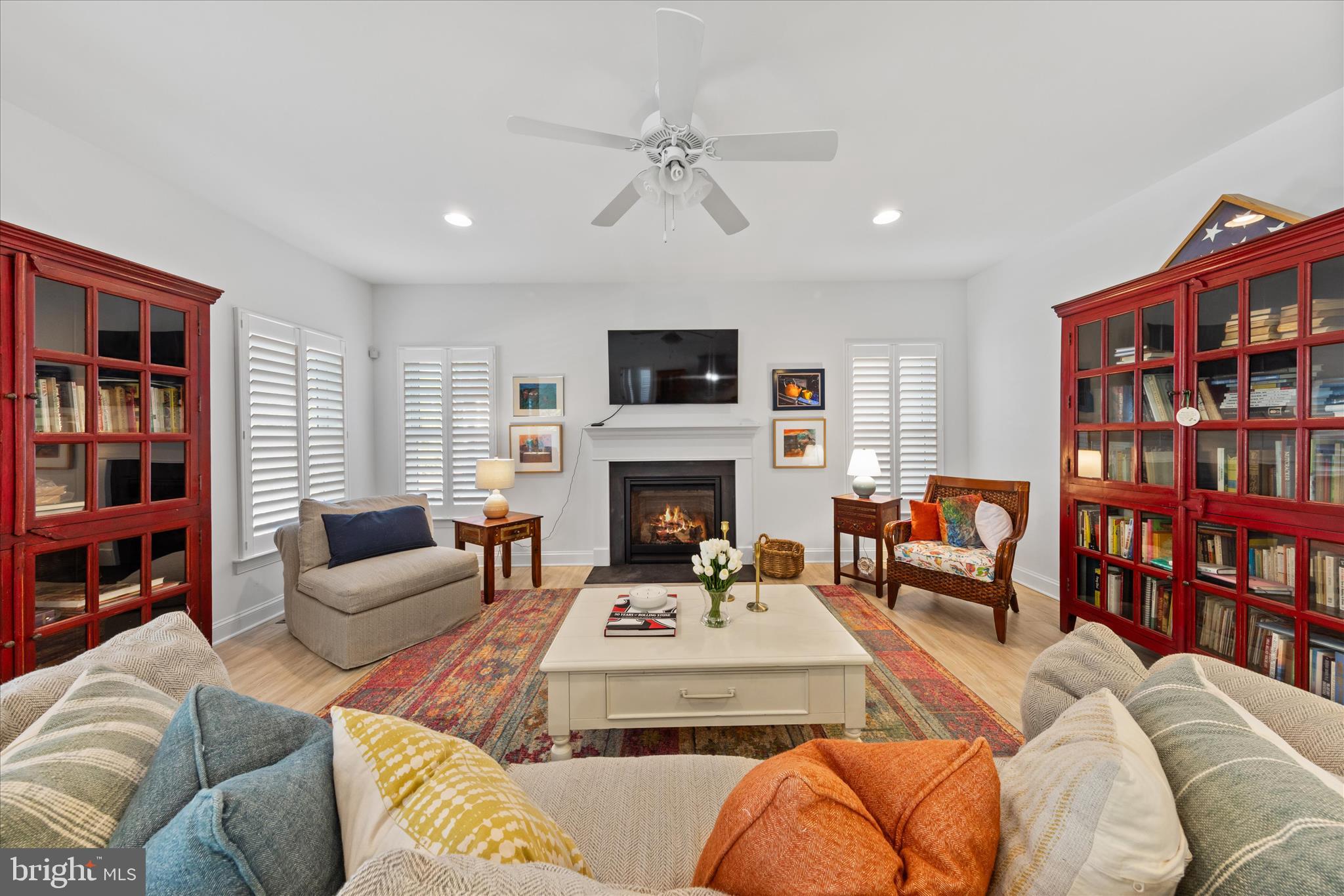 19181 Alcott Way Georgetown, DE 19947 - Photo 4 of 41 a living room with furniture a rug and a book shelf