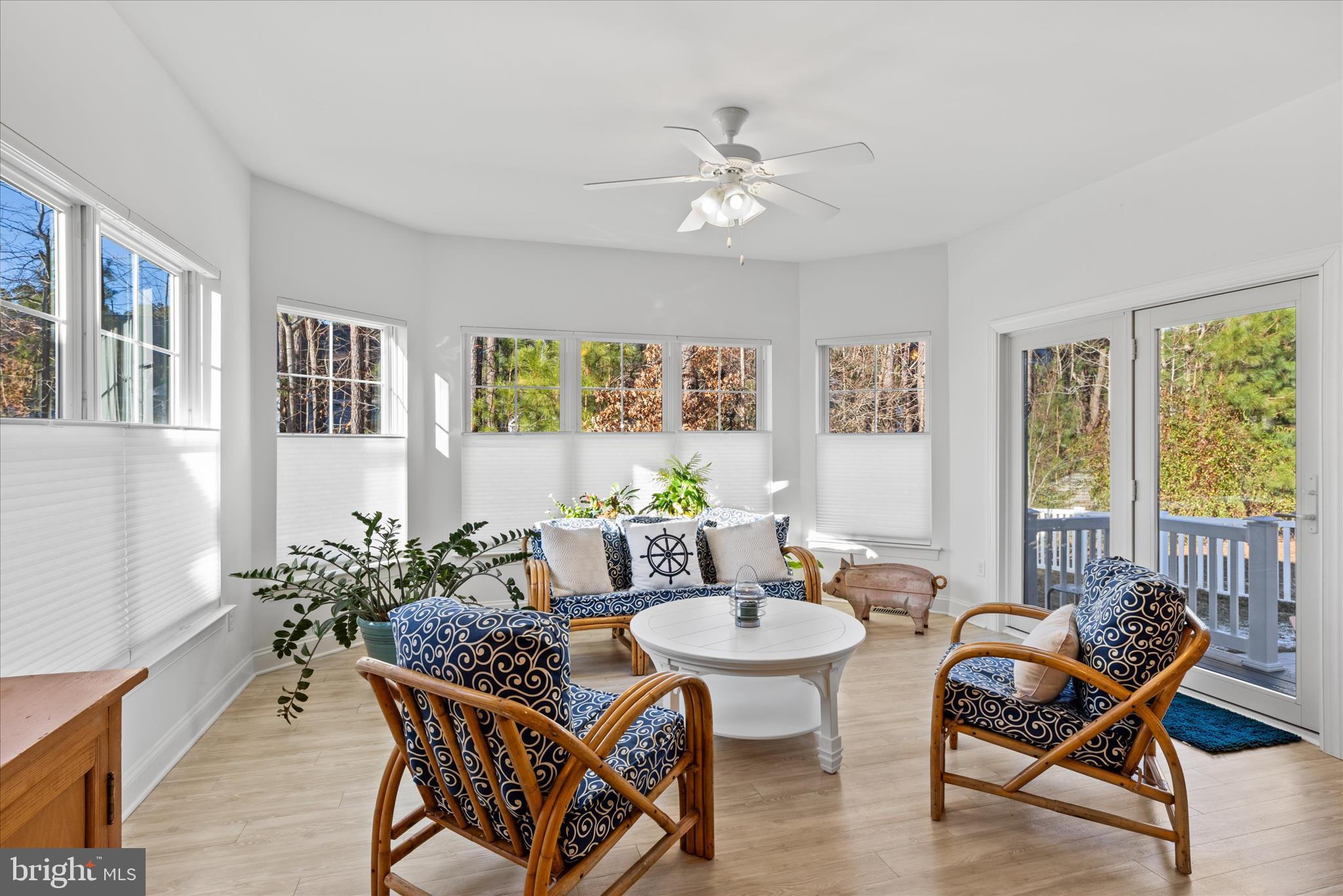 19181 Alcott Way Georgetown, DE 19947 - Photo 5 of 41 a dining room with furniture a window and wooden floor