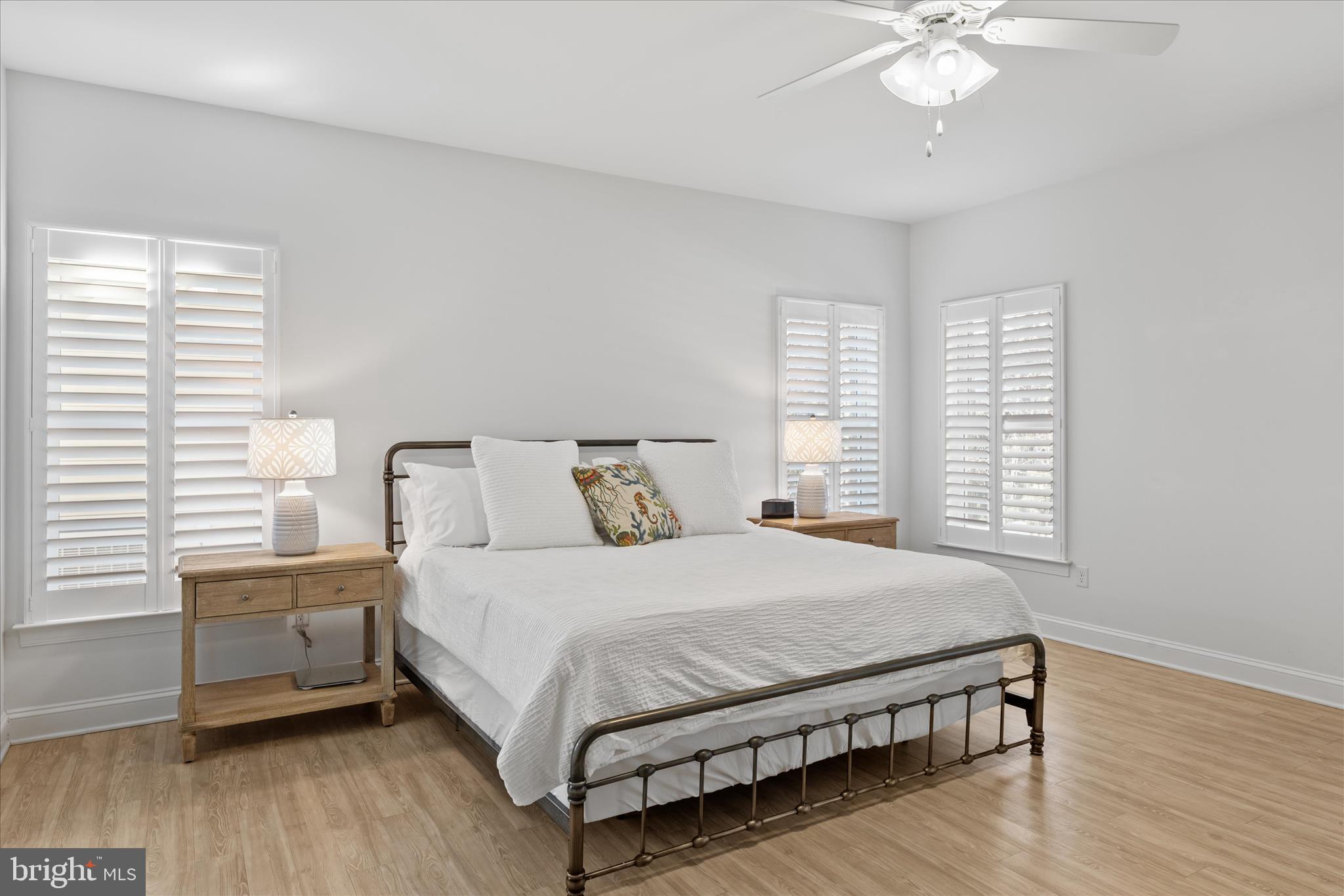 19181 Alcott Way Georgetown, DE 19947 - Photo 8 of 41 a bedroom with a bed and a chandelier