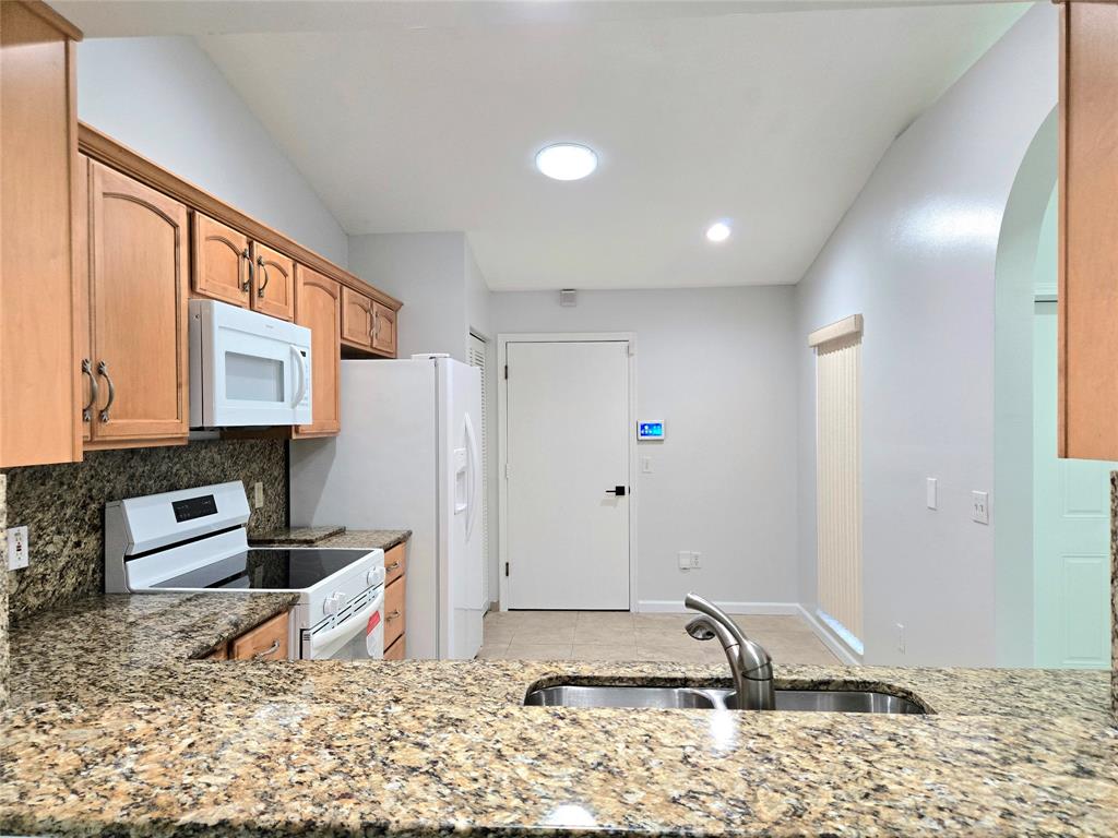 5912 Northwest 93rd Terrace Tamarac, FL 33321 - Photo 14 of 29 a very nice looking room with a large window