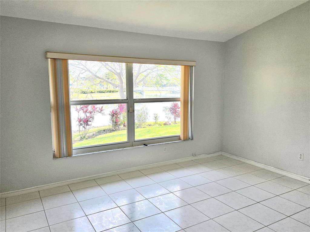 5912 Northwest 93rd Terrace Tamarac, FL 33321 - Photo 19 of 29 an empty room with windows