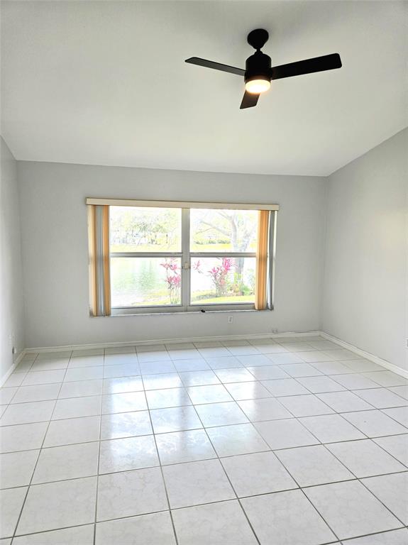 5912 Northwest 93rd Terrace Tamarac, FL 33321 - Photo 20 of 29 a view of an empty room with a window