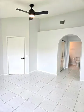 a view of livingroom with hardwood floor and a ceiling fan