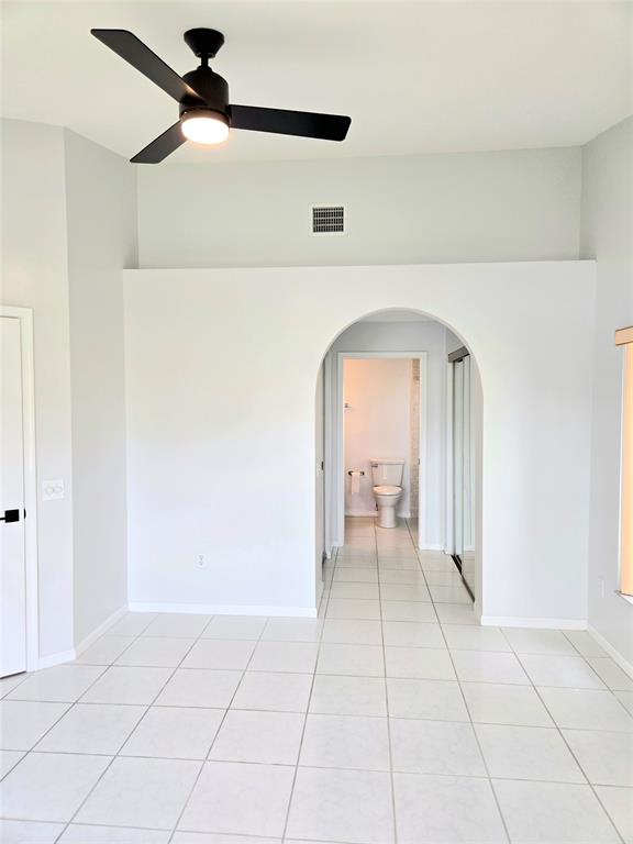 5912 Northwest 93rd Terrace Tamarac, FL 33321 - Photo 22 of 29 a view of livingroom with hardwood floor and a ceiling fan