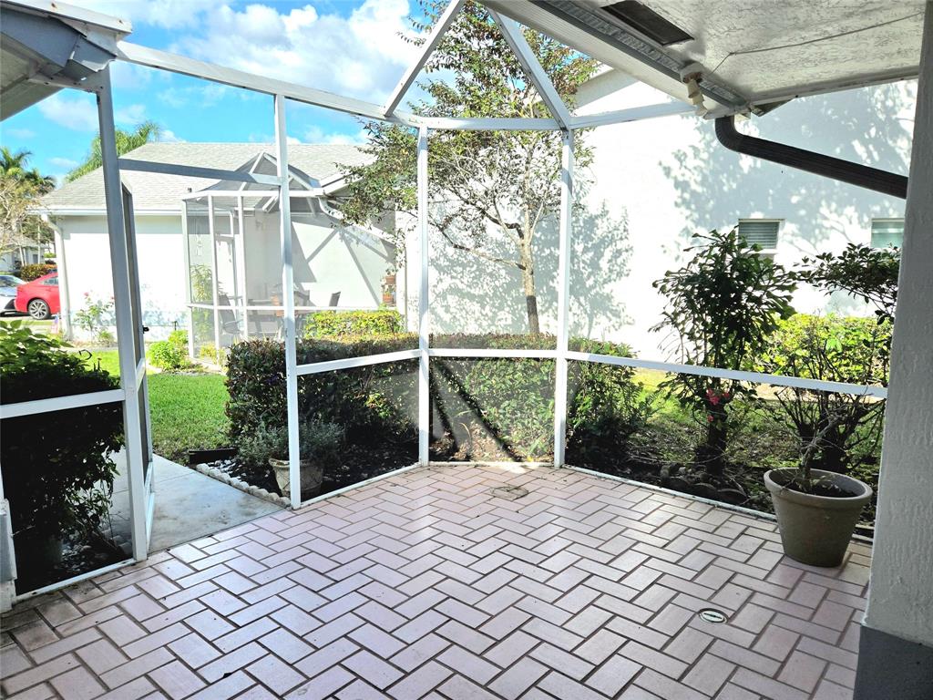 5912 Northwest 93rd Terrace Tamarac, FL 33321 - Photo 4 of 29 a house view with a garden space