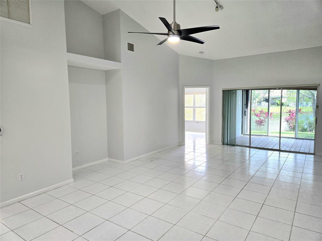 5912 Northwest 93rd Terrace Tamarac, FL 33321 - Photo 6 of 29 a view of an empty room and window