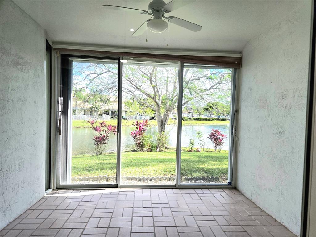 5912 Northwest 93rd Terrace Tamarac, FL 33321 - Photo 7 of 29 a view of an empty room with a large window