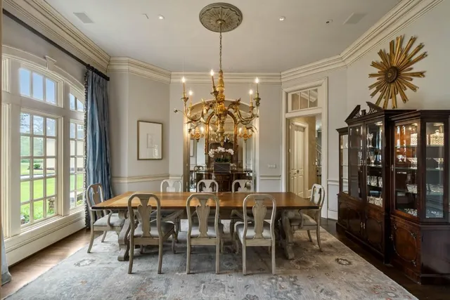 a backyard of a house with barbeque oven table and chairs