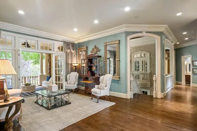 a spacious bedroom with a large bed and a large window