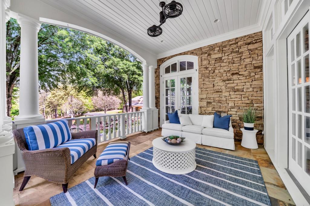 10955 Stroup Road Roswell, GA 30075 - Photo 27 of 73 a living room with furniture and a floor to ceiling window