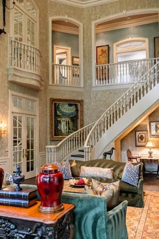 a bedroom with a bed couch and window