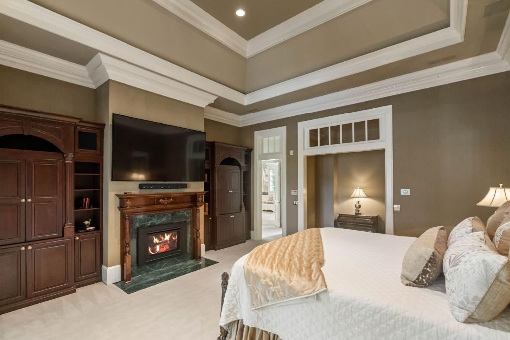 10955 Stroup Road Roswell, GA 30075 - Photo 36 of 73 a bedroom with a bed and a television