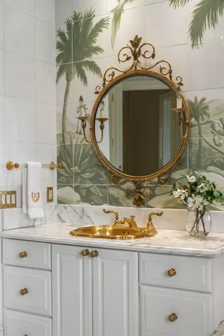 a view of swimming pool with lawn chairs and plants