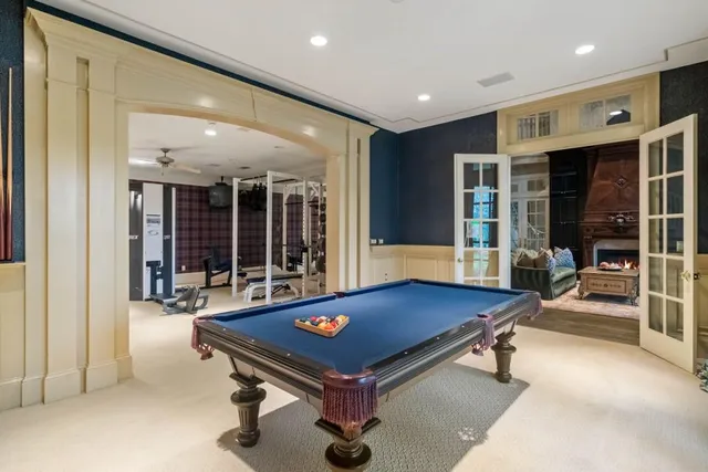 a view of a lake with couches chairs