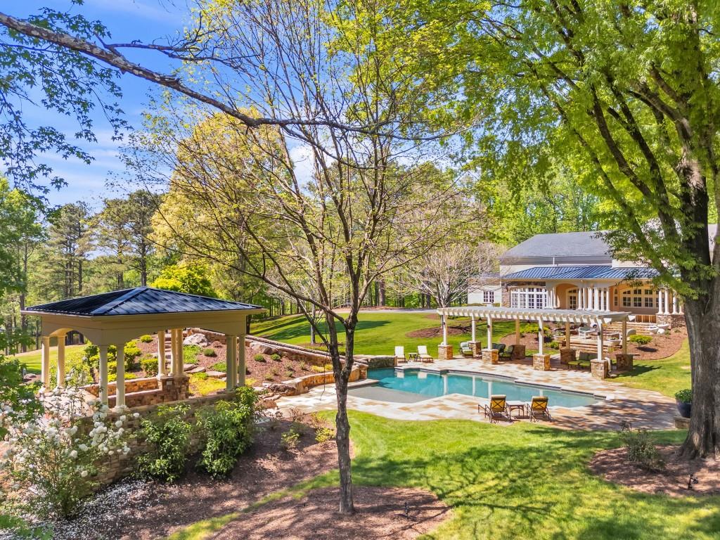10955 Stroup Road Roswell, GA 30075 - Photo 57 of 73 a view of a house with a yard