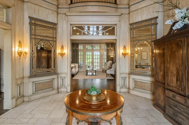 a kitchen with stainless steel appliances granite countertop a sink a stove and a wooden floors