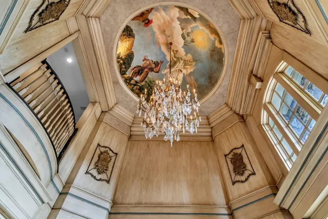 a view of a dining room with furniture and windows