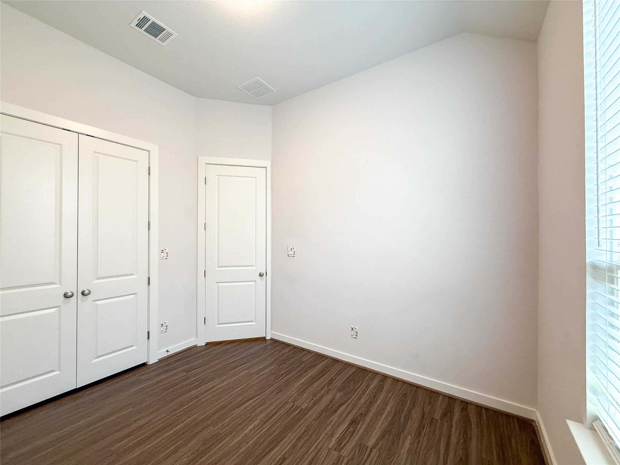 249 Heartleaf Road San Marcos, TX 78666 - Photo 27 of 38 Rich hardwood-style flooring and natural light elevate this inviting and versatile space.