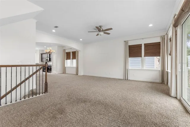 a view of a swimming pool with chairs