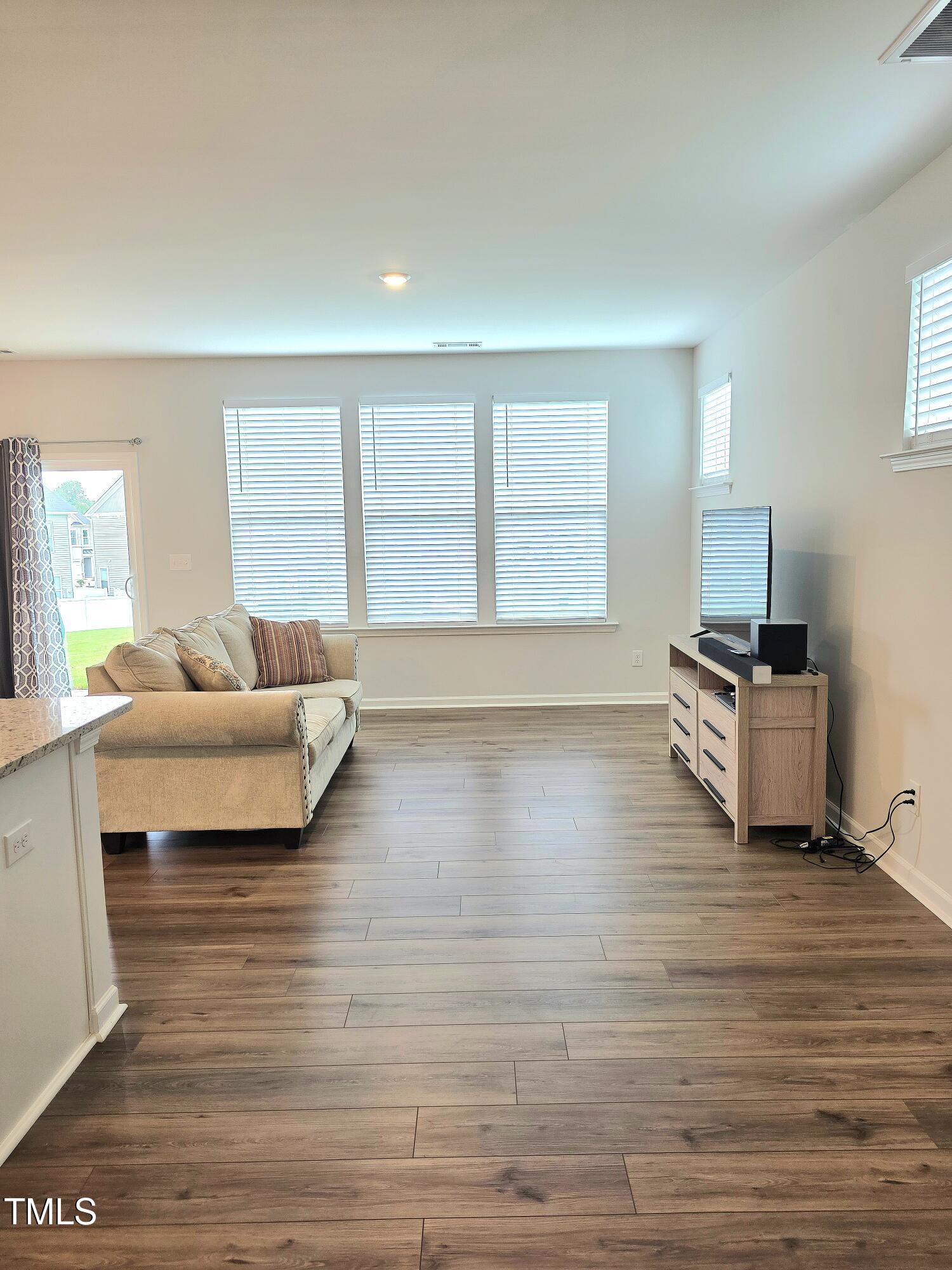 27 Nettle Lane Clayton, NC 27520 - Photo 11 of 37 a living room with furniture and a large window
