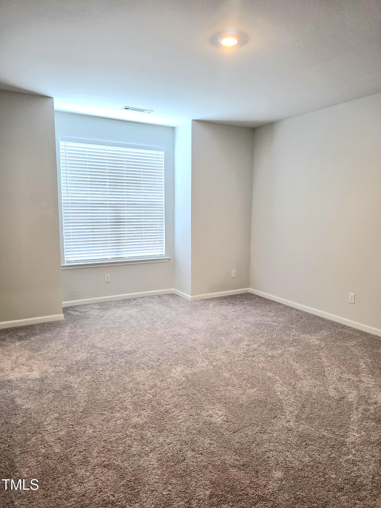 27 Nettle Lane Clayton, NC 27520 - Photo 22 of 37 an empty room with a window