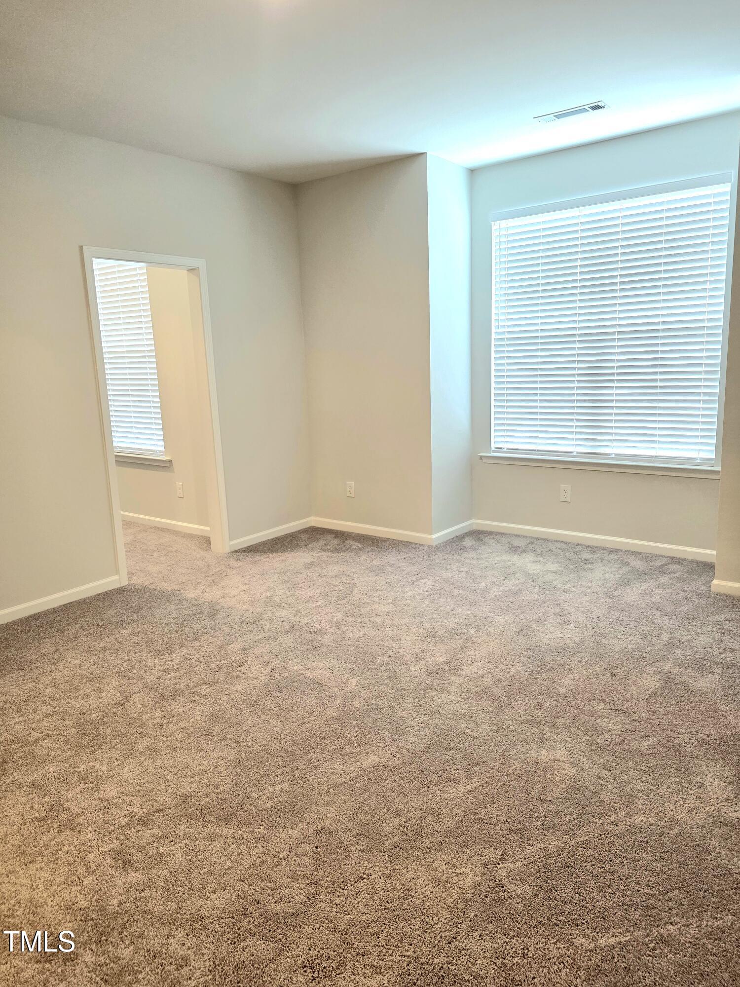 27 Nettle Lane Clayton, NC 27520 - Photo 23 of 37 a view of an empty room with a window
