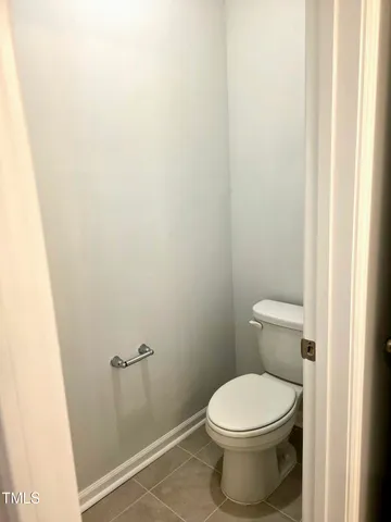 a view of an empty room and a window