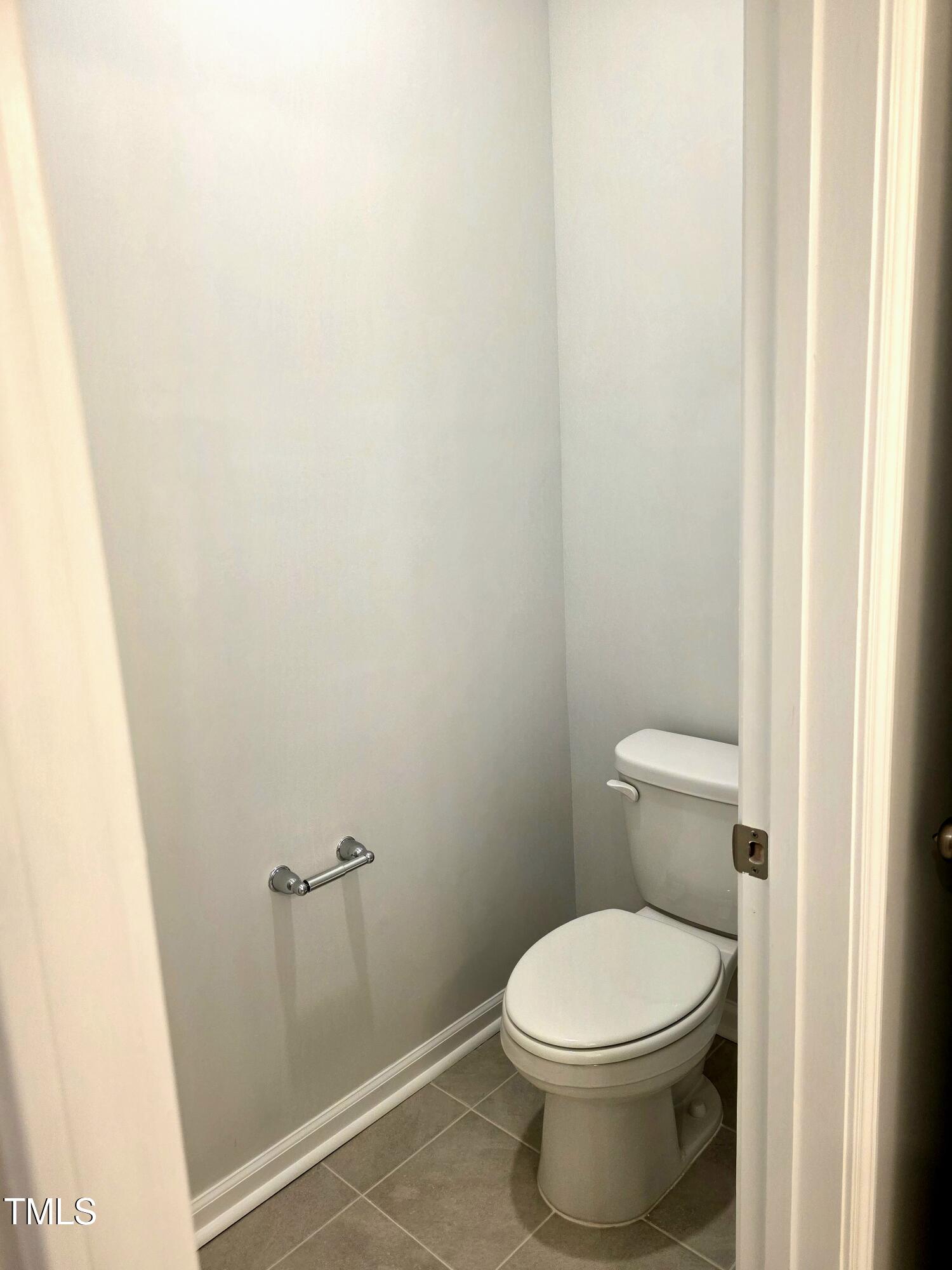 27 Nettle Lane Clayton, NC 27520 - Photo 27 of 37 a white toilet sitting next to a shower