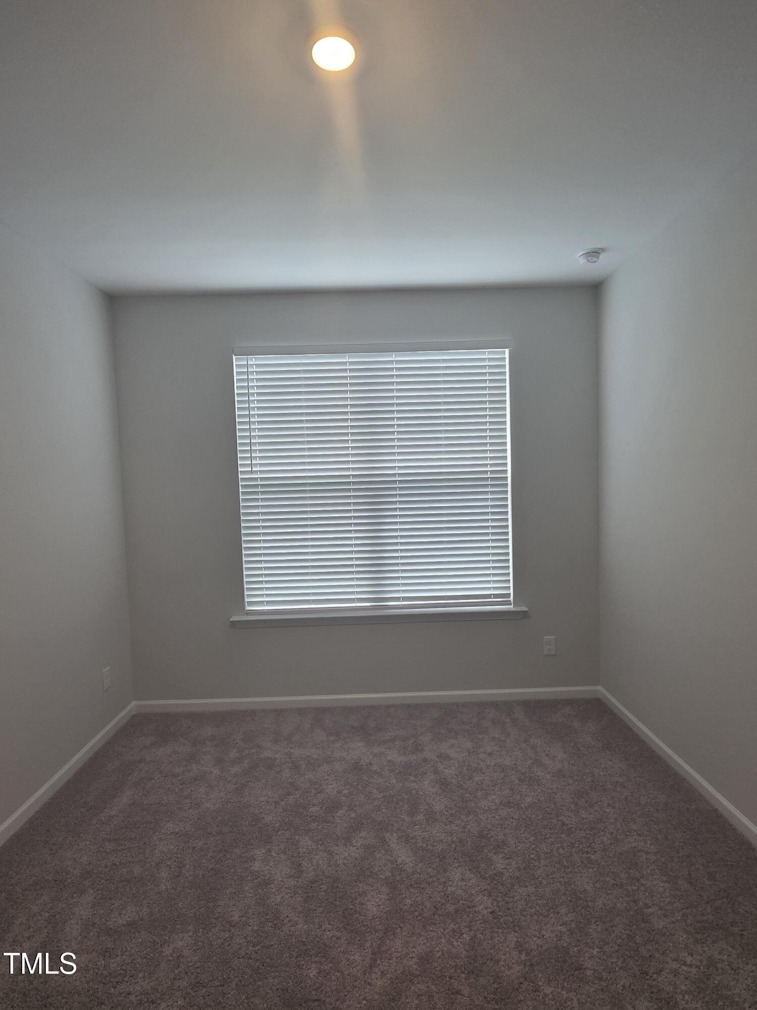 27 Nettle Lane Clayton, NC 27520 - Photo 30 of 37 an empty room with a window