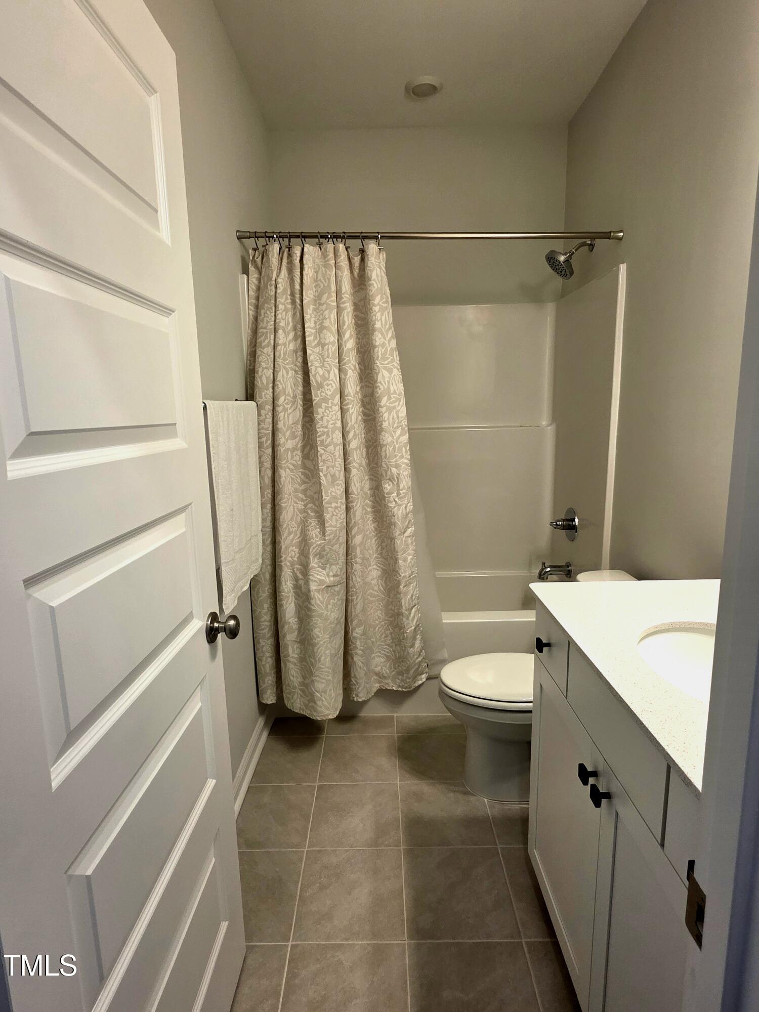 27 Nettle Lane Clayton, NC 27520 - Photo 34 of 37 a bathroom with a sink a toilet and a shower