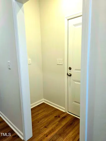a view of a bathroom with wooden floor