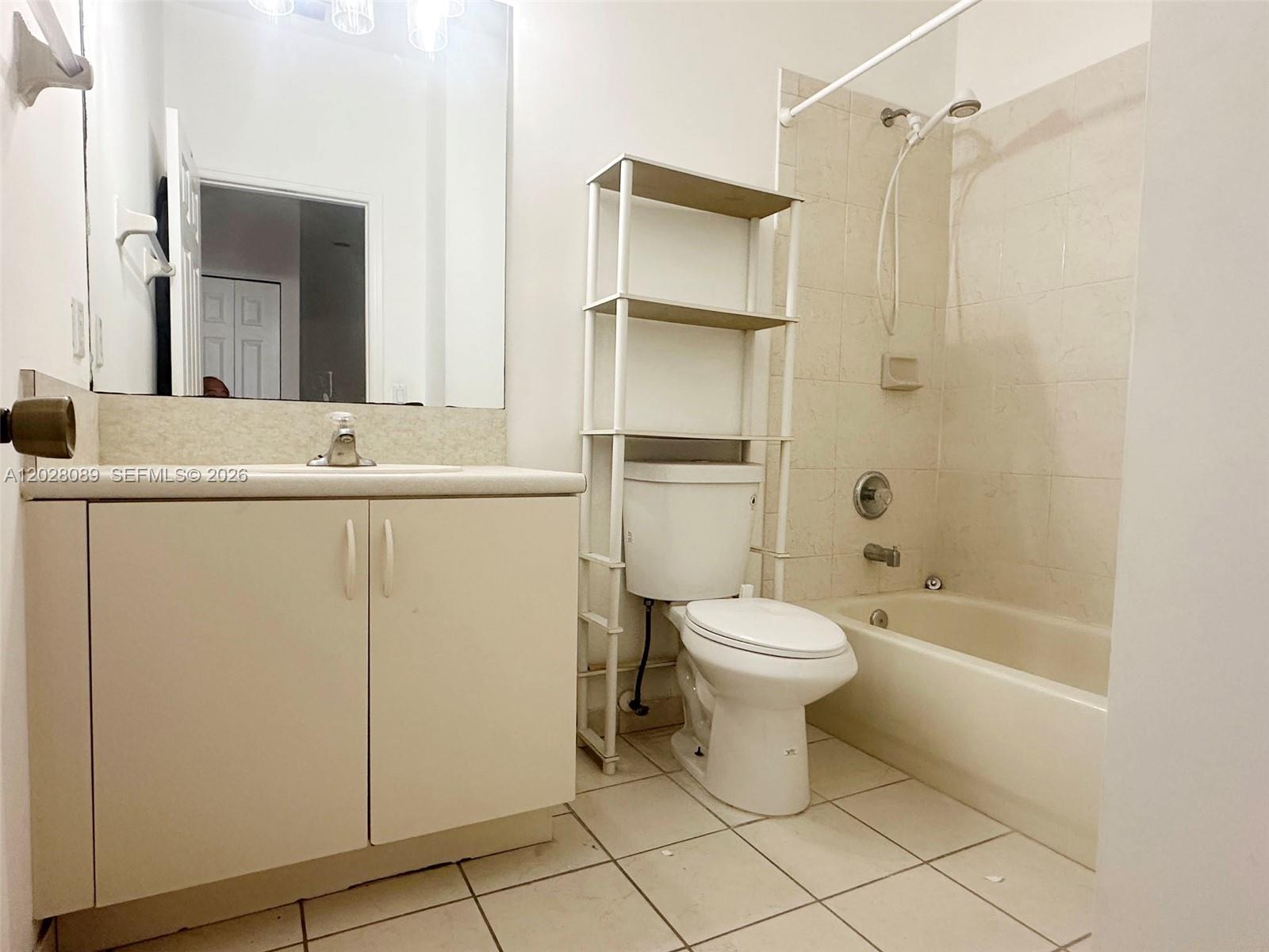 662 Northeast 21st Terrace Homestead, FL 33033 - Photo 23 of 34 a bathroom with a toilet sink and shower