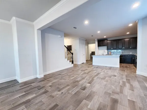 a view of kitchen with wooden floor