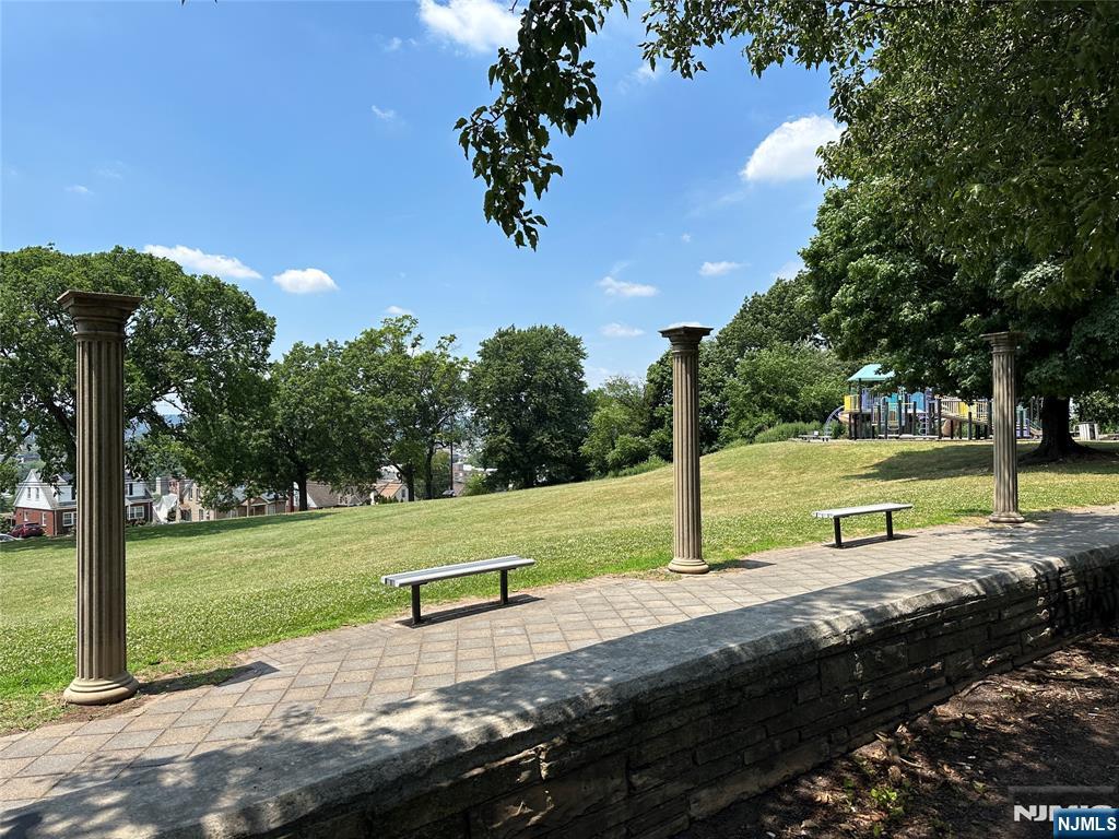 70 Orchard Street Garfield, NJ 07026 - Photo 11 of 17 a view of a park with large trees