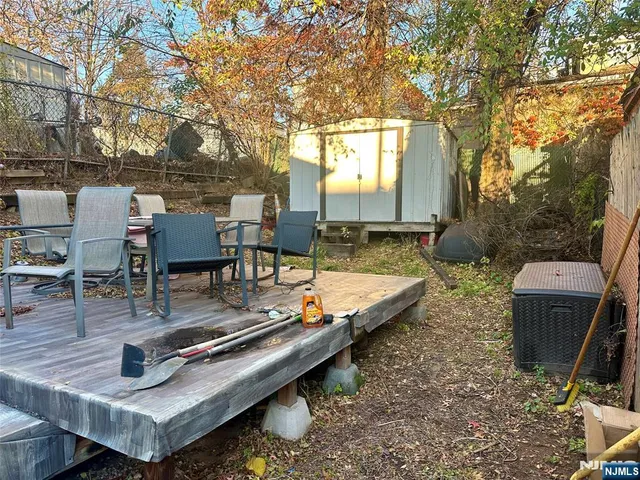 a view of a backyard with sitting area and furniture