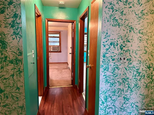 view of hallway with wooden floor
