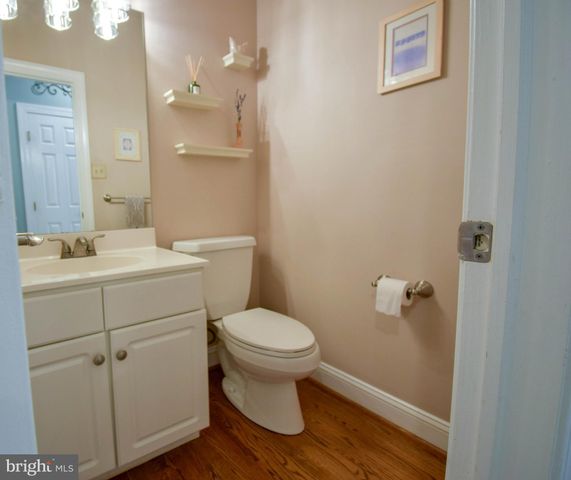 a view of staircase with railing and a chandelier