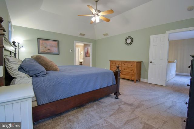 a bathroom with a shower sink and mirror