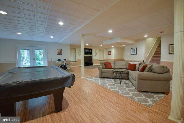 a view of a livingroom with furniture and a fireplace