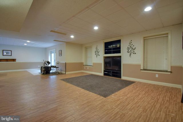a media room with lots of chairs and a projector screen