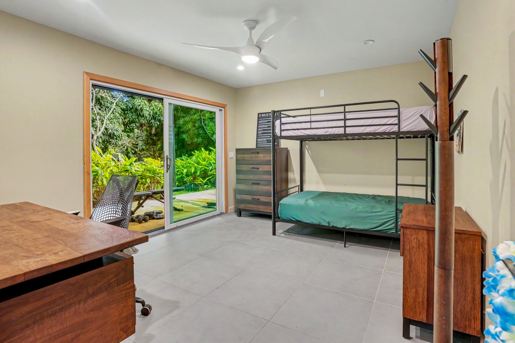 4470 A Wailapa Road Kilauea, HI 96754 - Photo 20 of 30 a bedroom with furniture and a window
