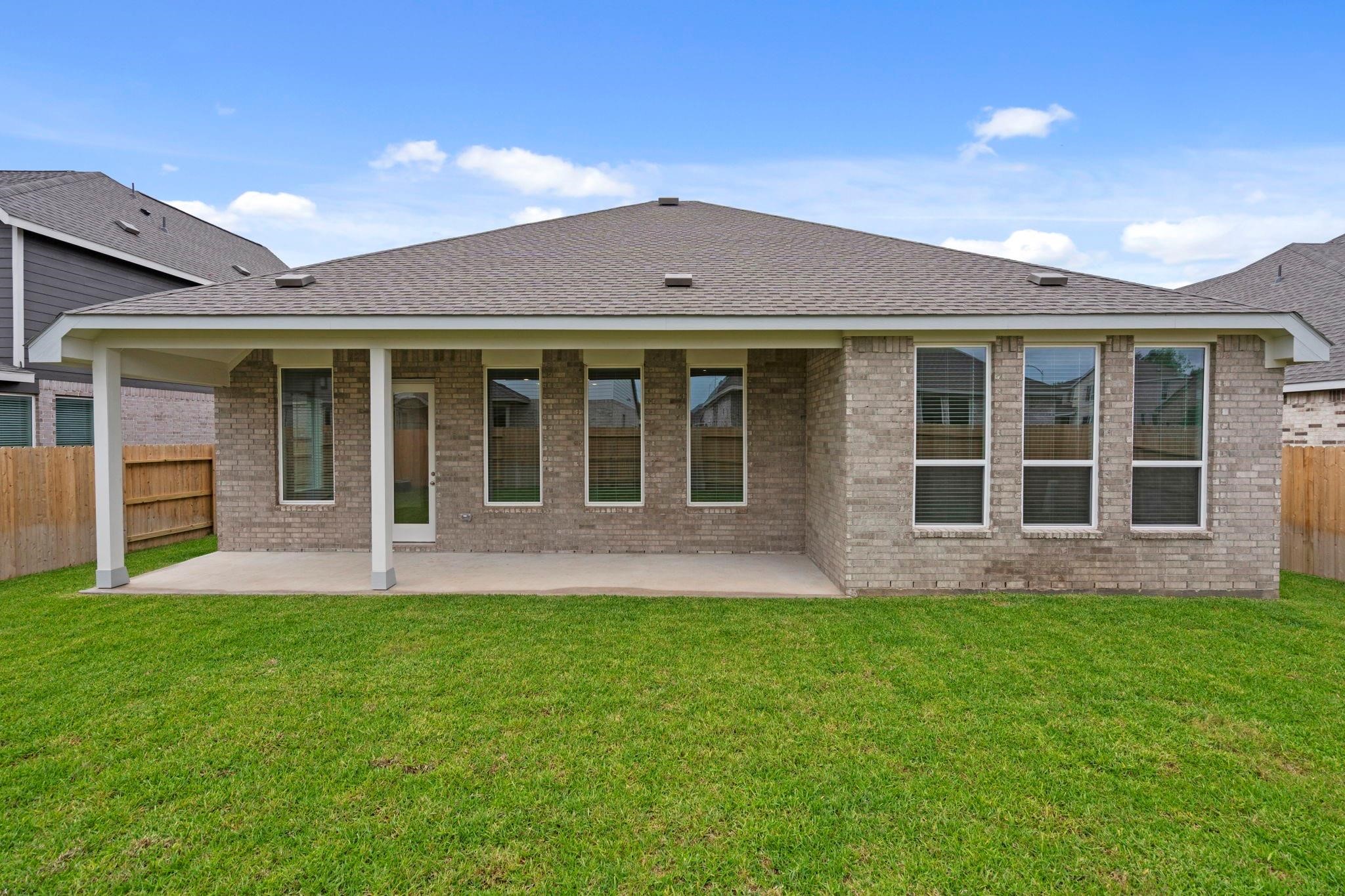 2716 Pine Bluff Drive Rosenberg, TX 77469 - Photo 29 of 32 front view of a brick house with a large windows