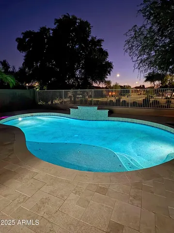 a view of a swimming pool with an outdoor seating