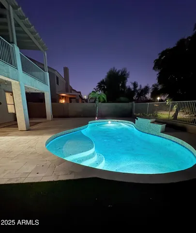 a view of swimming pool outdoor with seating space