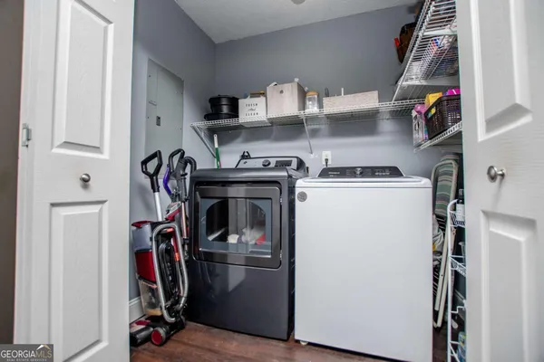 a view of a storage and utility room with washer and dryer