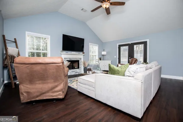 a living room with furniture and a flat screen tv