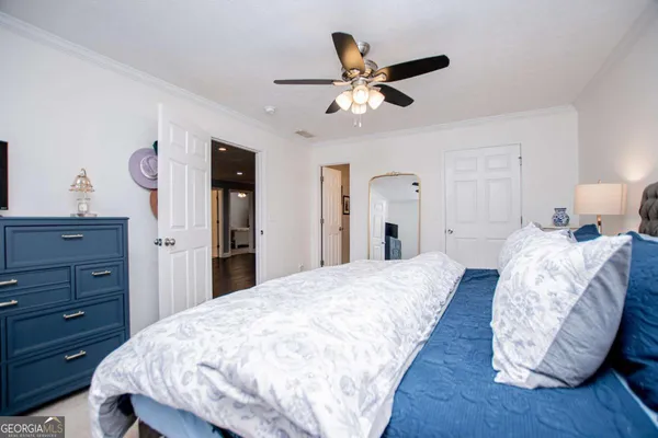 a bedroom with a bed and a dresser