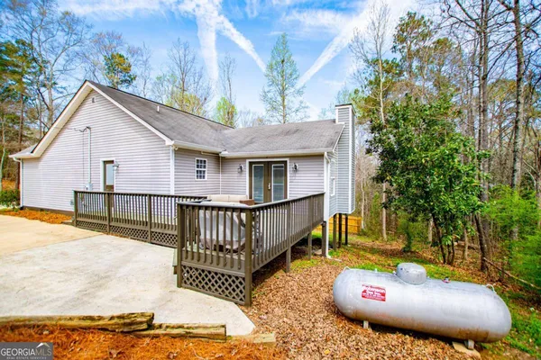 a view of a backyard with a small deck